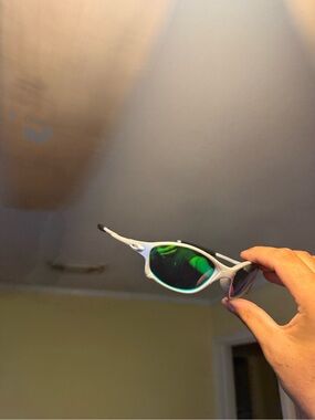 Oakley White Frame Sunglasses with Green Mirrored Lenses